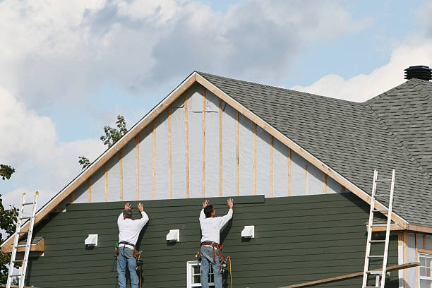Professional Storm Damage Siding Repair technician working in North, VA